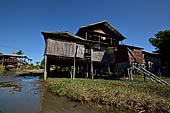 Inle Lake Myanmar. All the buildings are constructed on piles. Residents travel around by canoe, but there are also bamboo walkways and bridges over the canals, monasteries and stupas. 